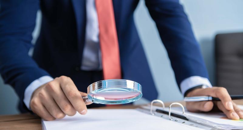 businessman looking with a magnifier