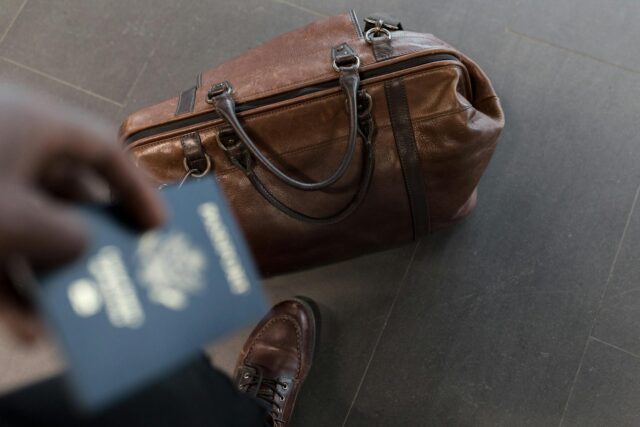 person holding passport