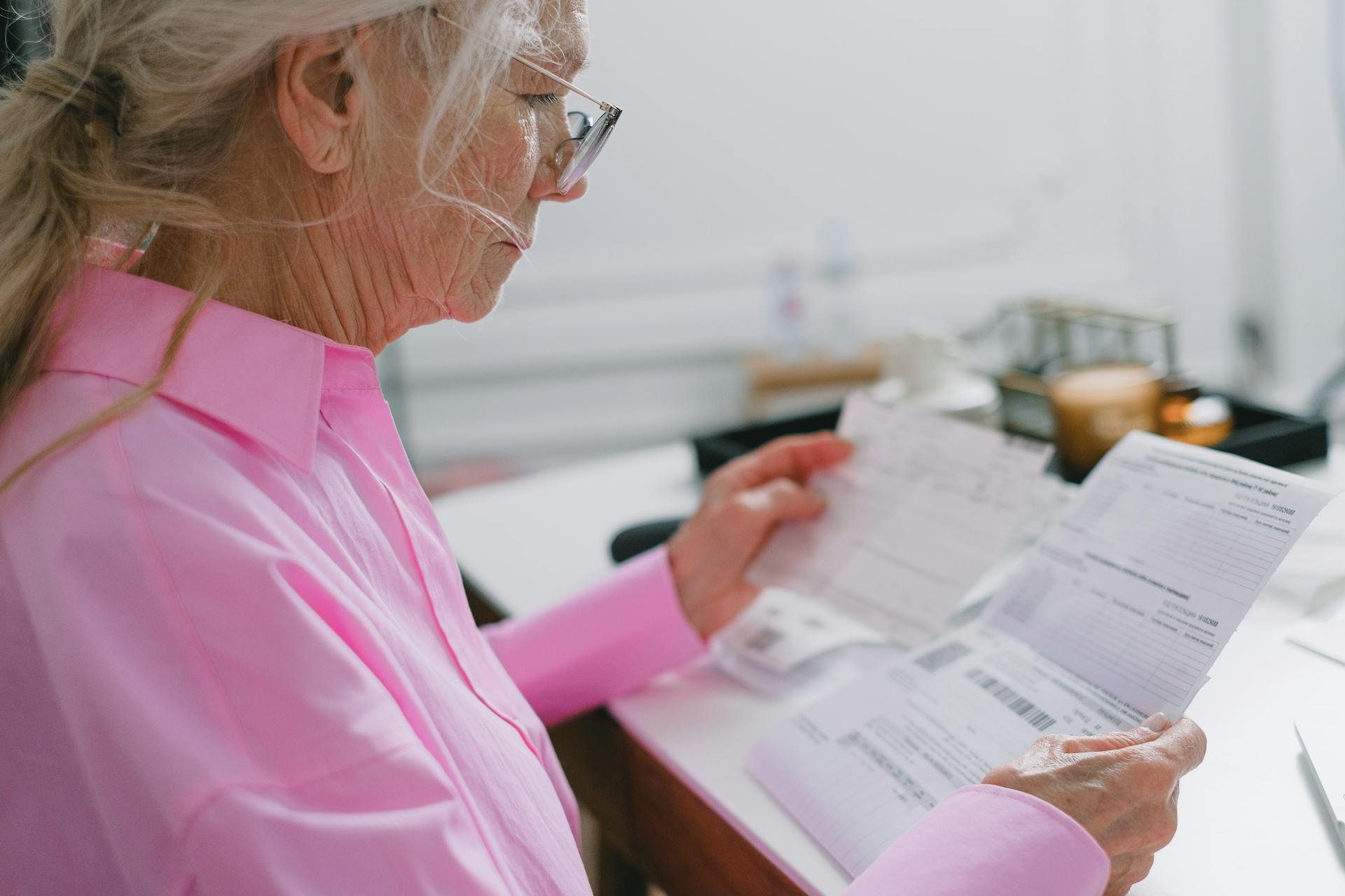 older woman looking at documents