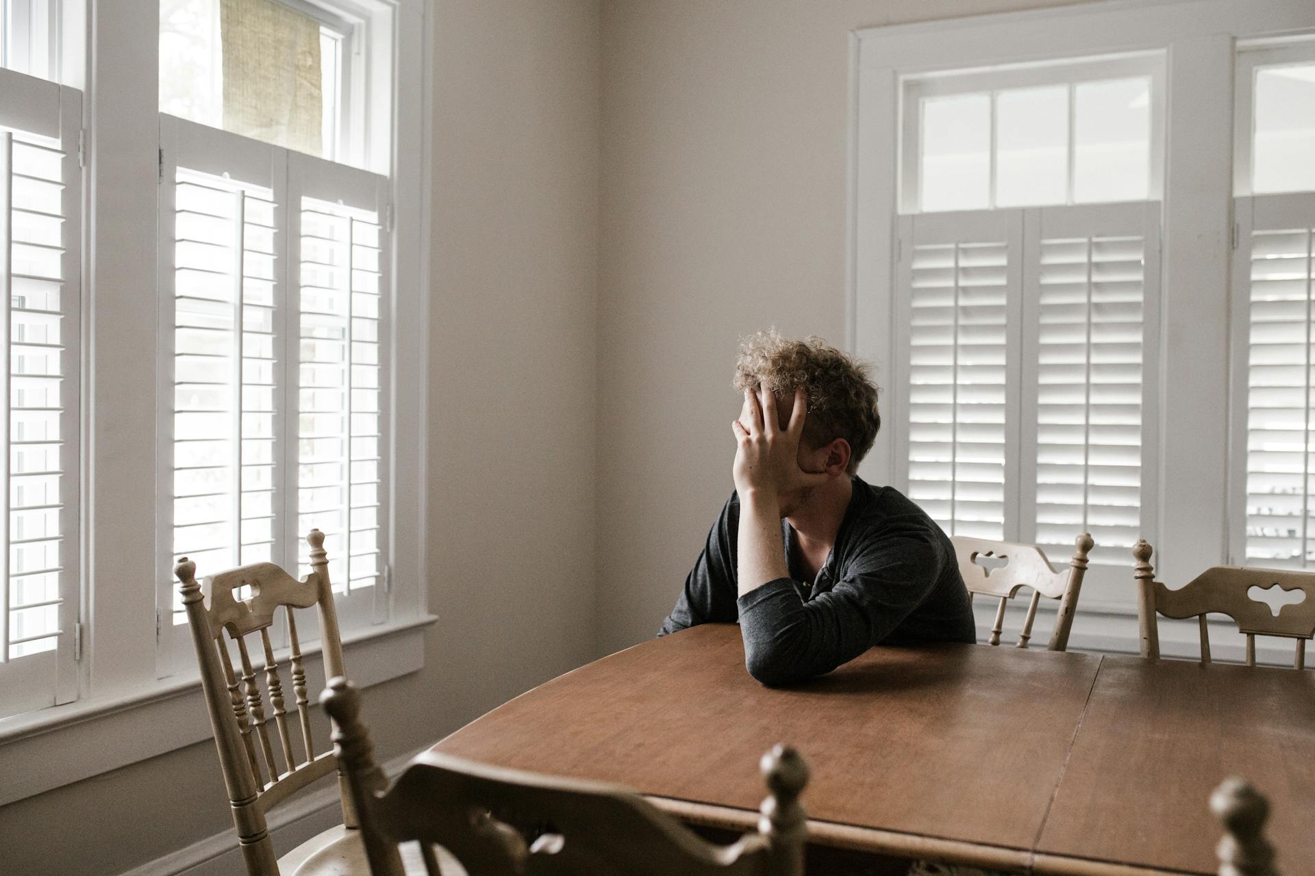 stressed man at table